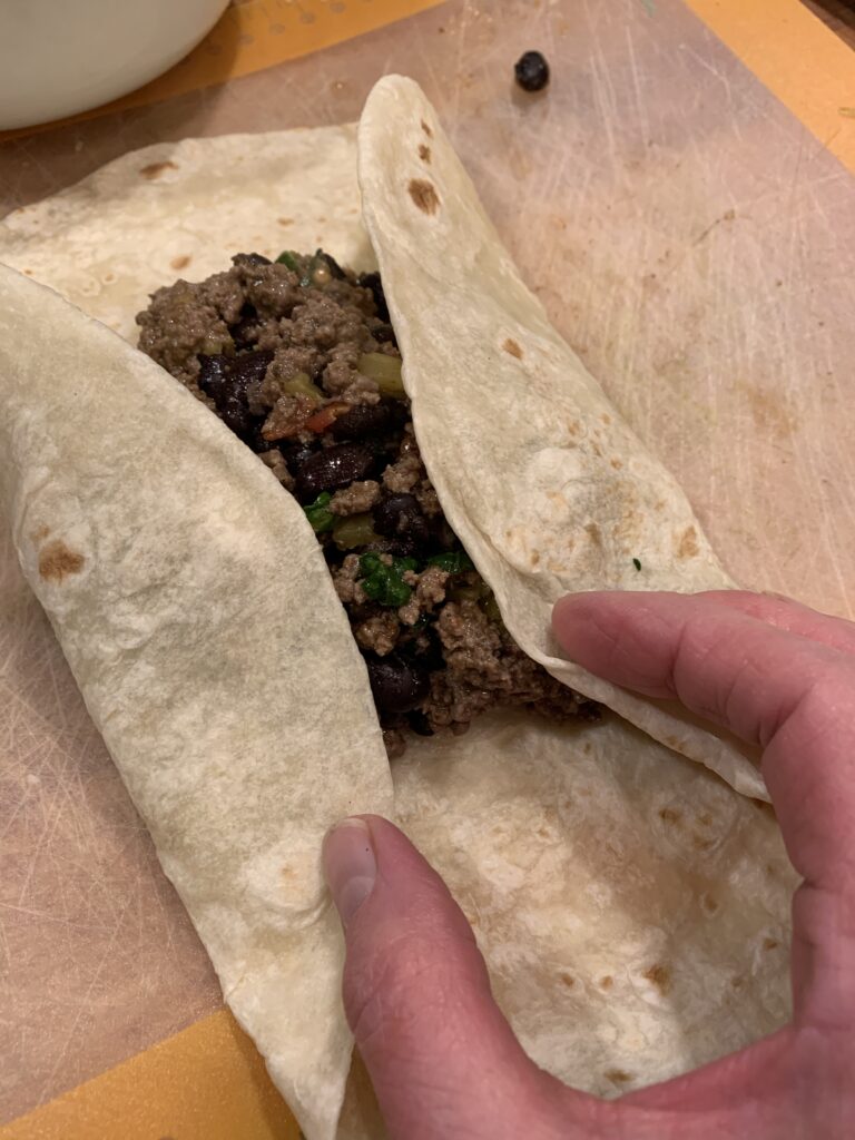 Flour tortilla containing beef filling. 