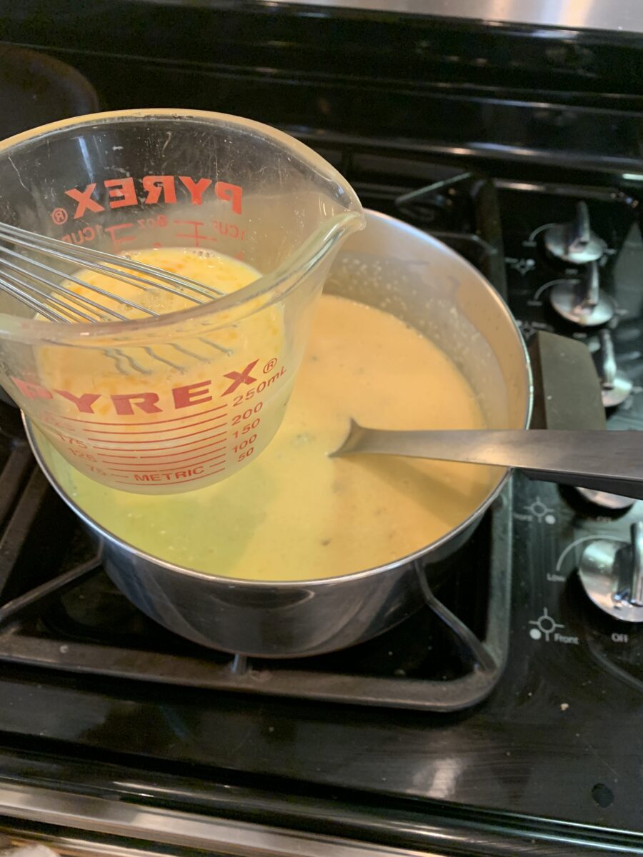 Grits cooking on the stove. 