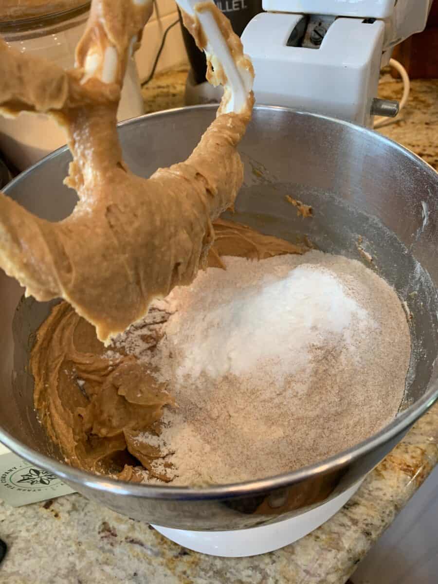 Peanut butter cookie ingredients in a mixer. 