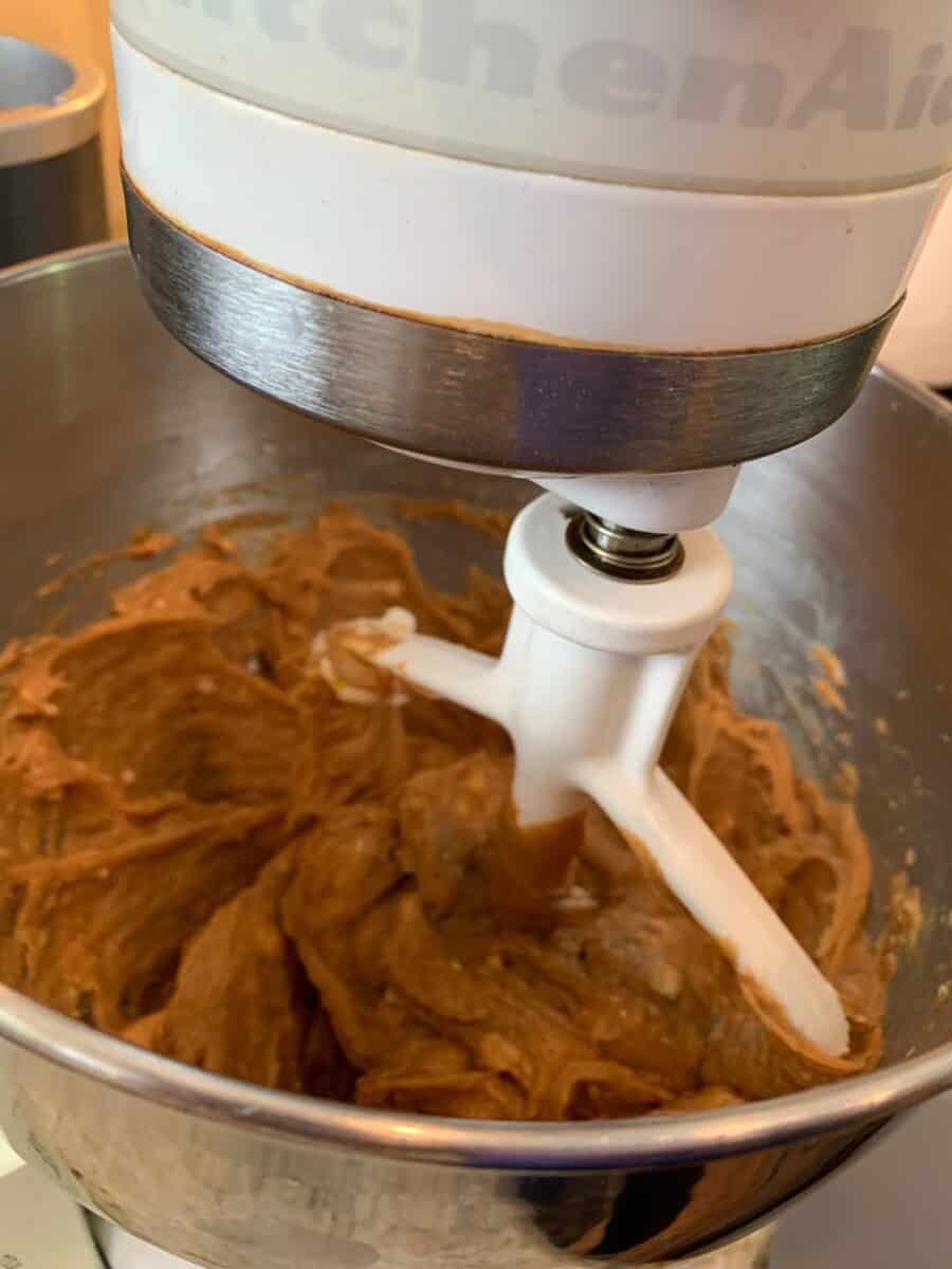 Raw cookie batter in a mixing bowl. 