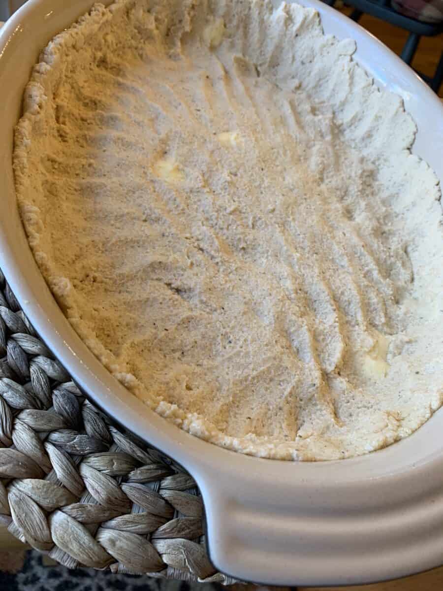 Tamale casserole crust in the bottom of baking dish.