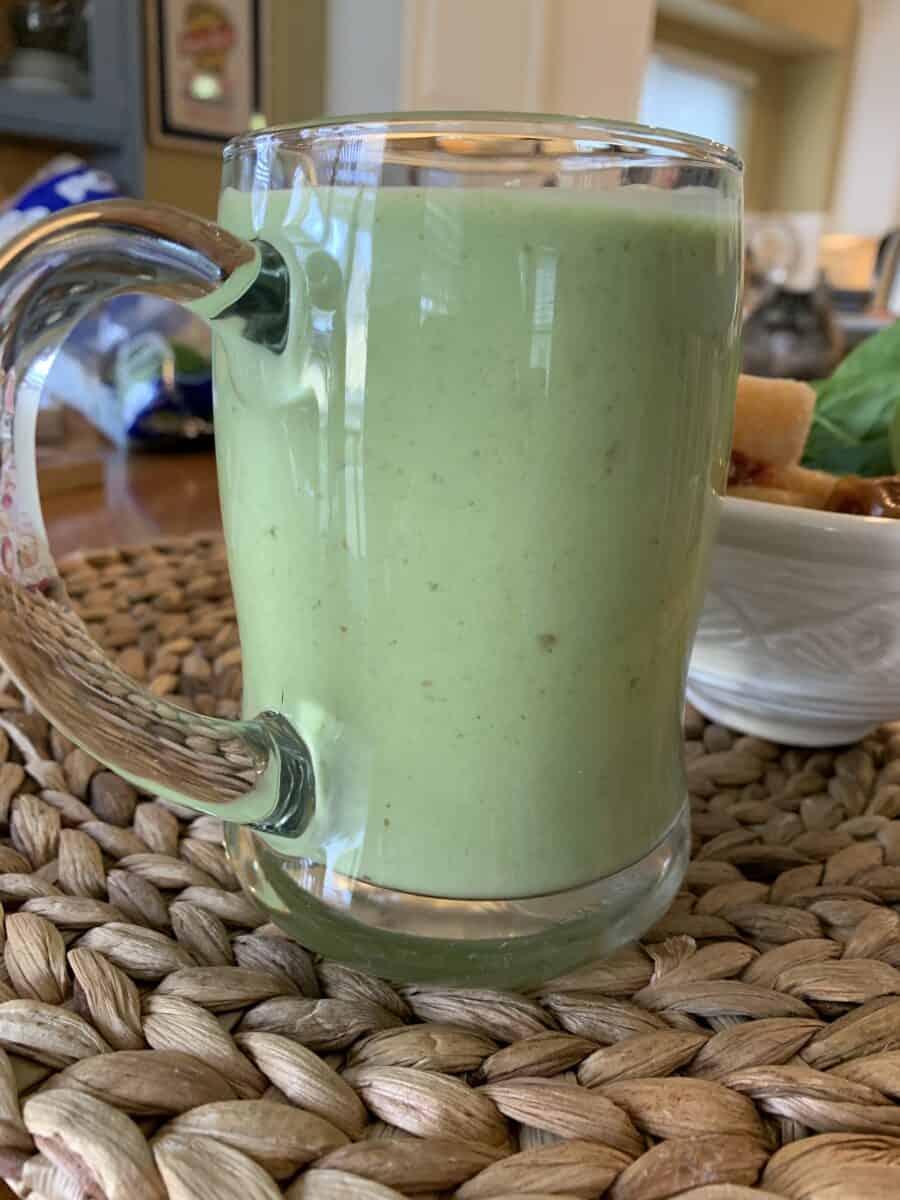 Smoothie in a large glass cup.