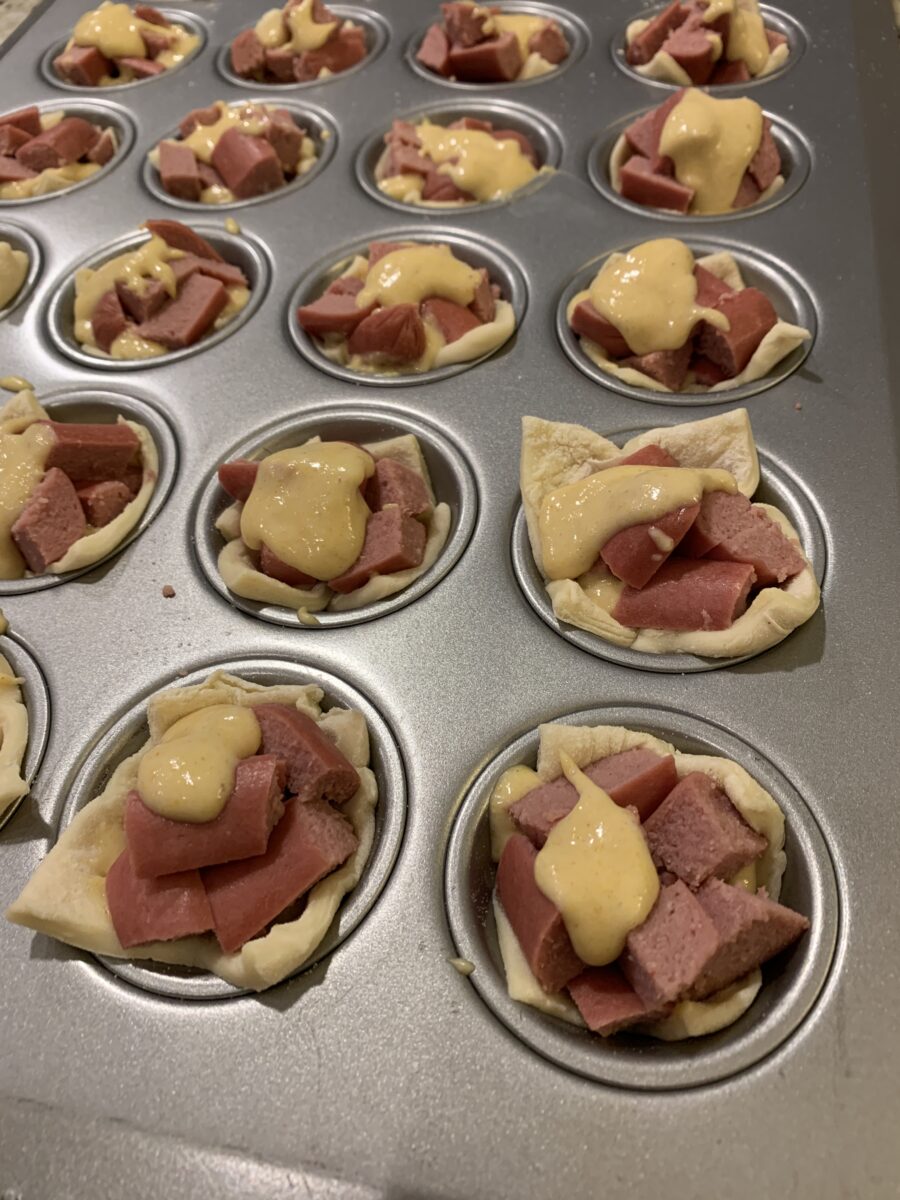 Corn dog nuggets in a pan, uncooked 