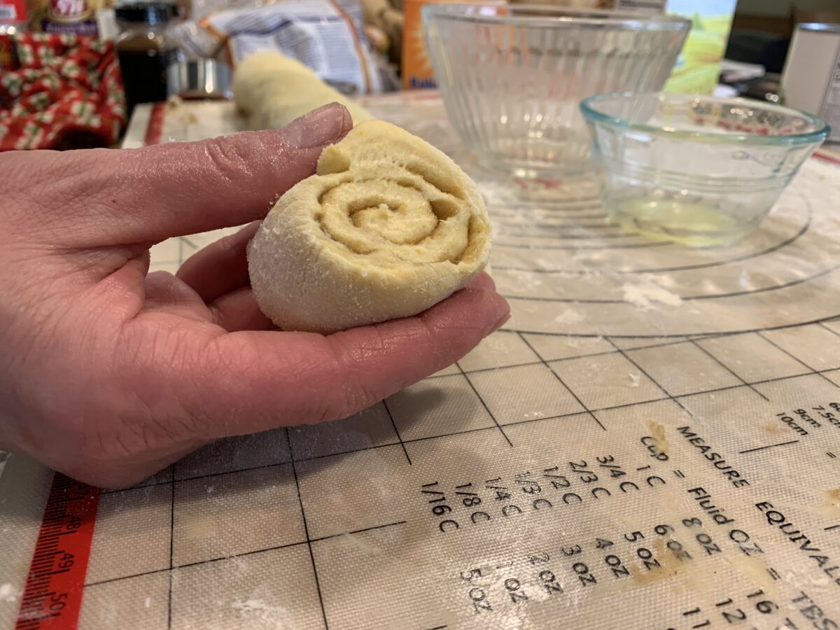 Sliced raw cinnamon roll dough. 