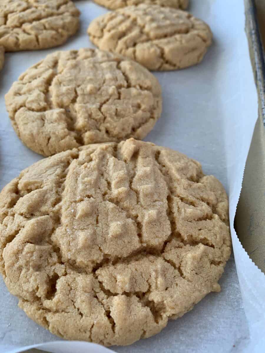 Baked cookies on parchment paper, on a baking sheet. 