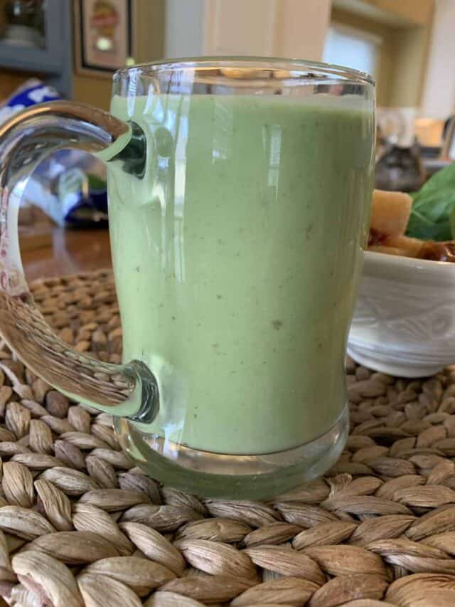 Sweet green smoothie in a glass mug