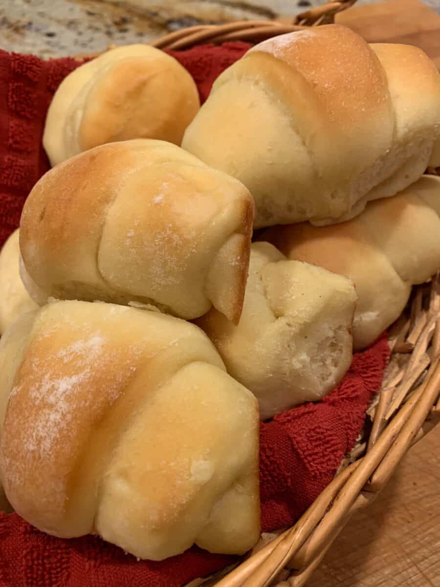 Potato rolls stacked in a serving basket