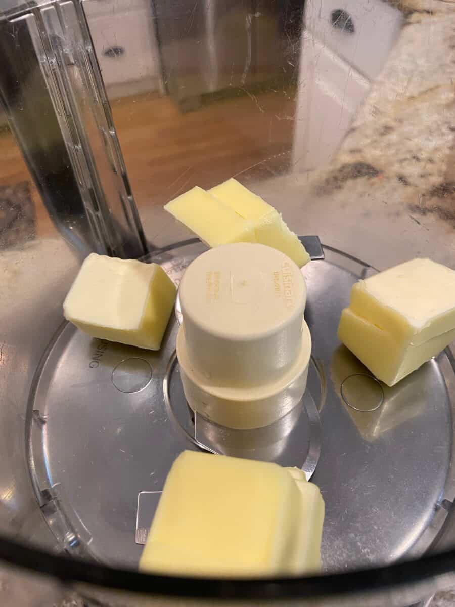 Cubed butter in a food processor