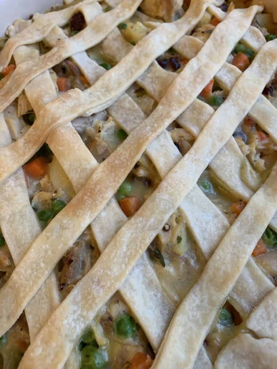 Lattice strips of pie crust on top of a pot pie. 