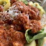 Tomato-cream sauce on top of plain and spinach tortellini.