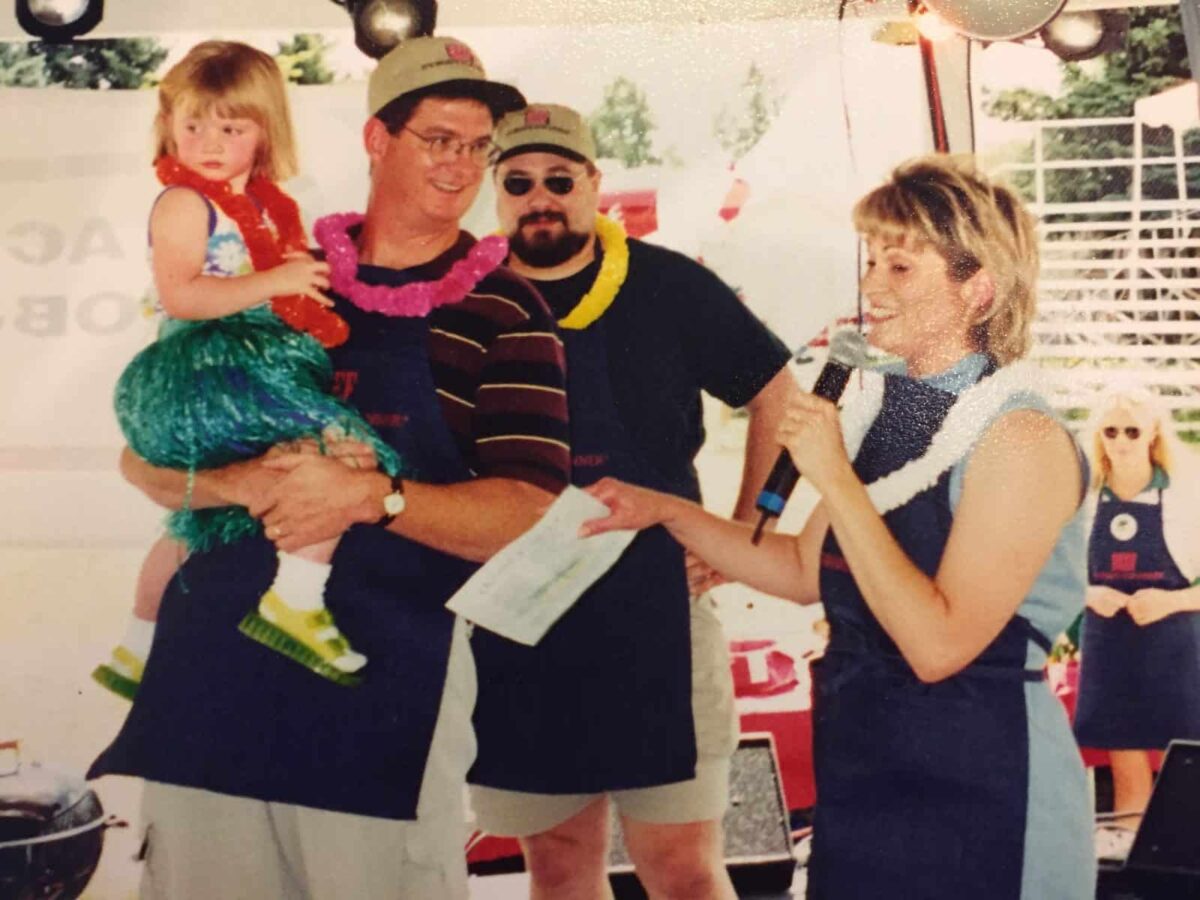 Western Idaho Fair, 1999. Beef Cookoff. Melinda holds a microphone on the stage.