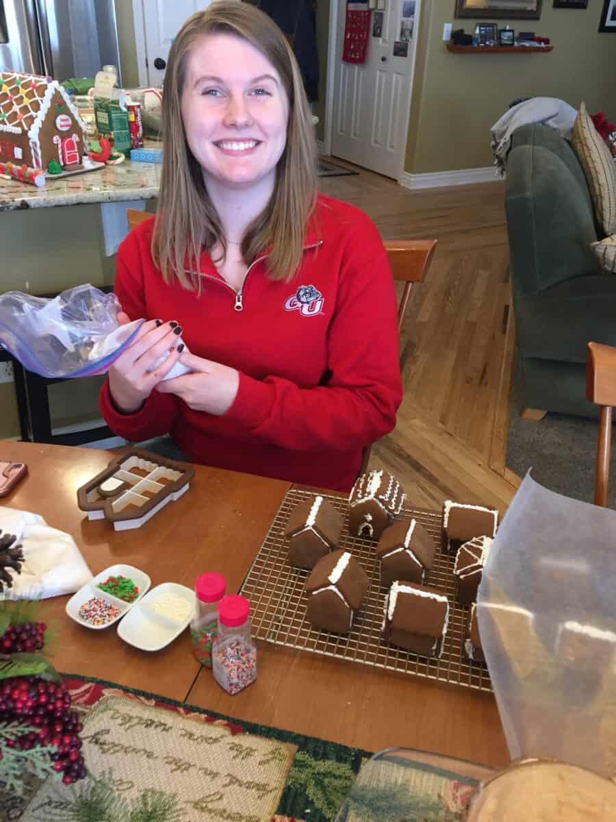 Madeline decorating each tiny gingerbread house. 