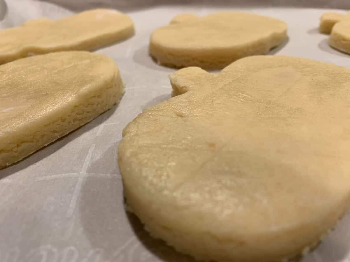 Raw cookies shaped like pumpkins. 