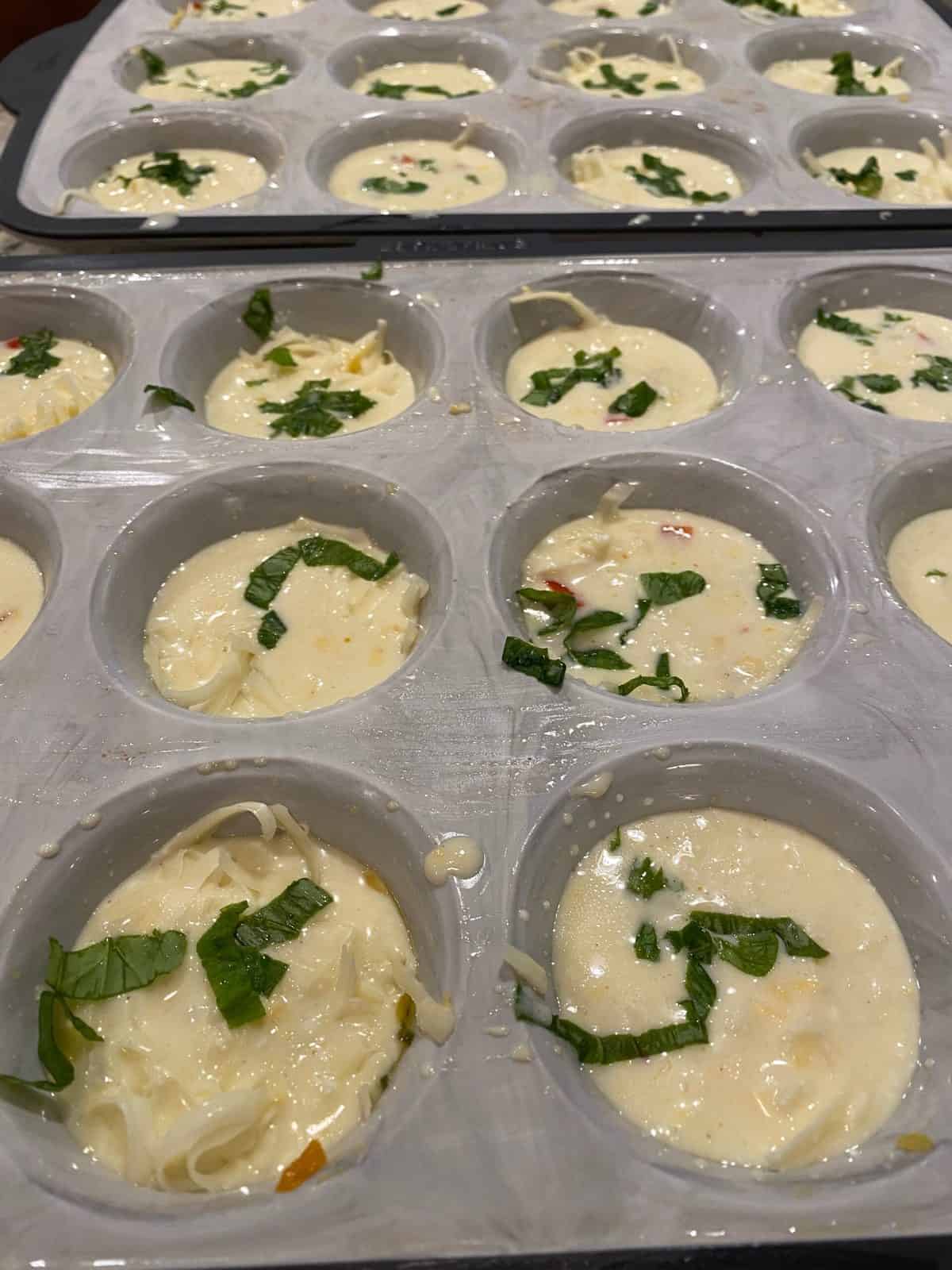 Egg bites with fresh basil on top.