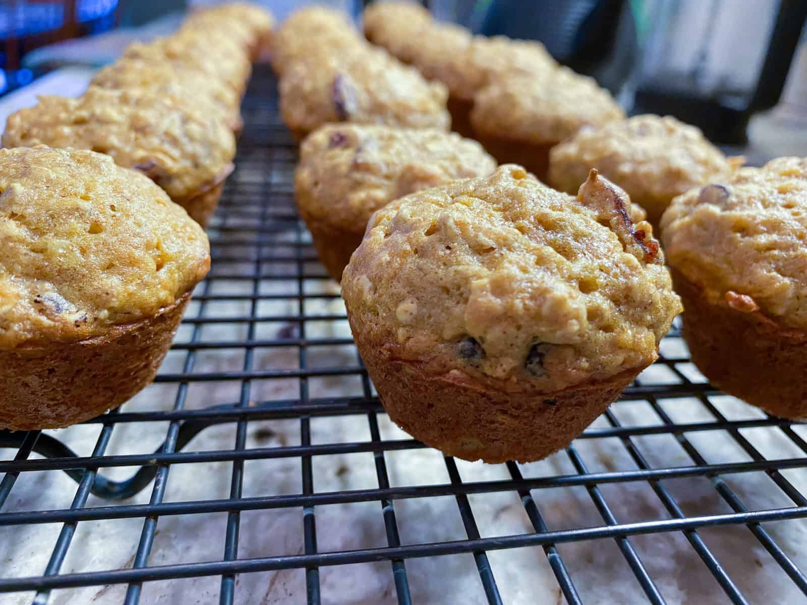 Mini muffins on a cooling rack.