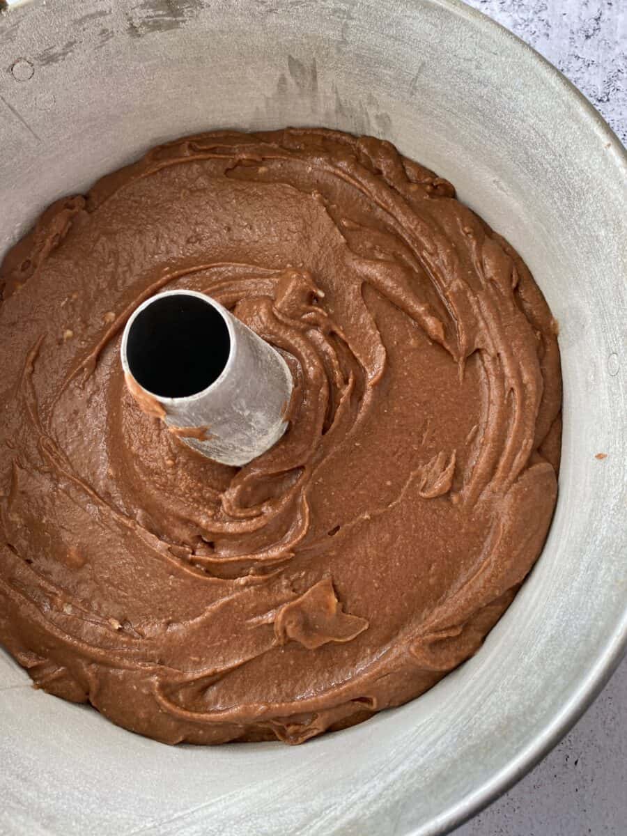 Raw cake batter in a baking pan.