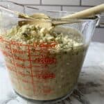 Blue cheese crumbles on top of blended ingredients.