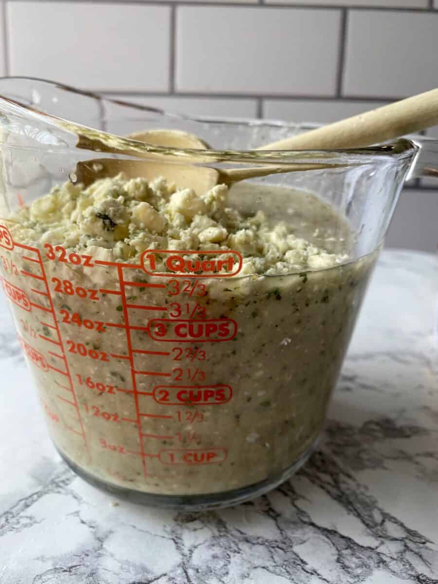 Blue cheese crumbles on top of blended ingredients.