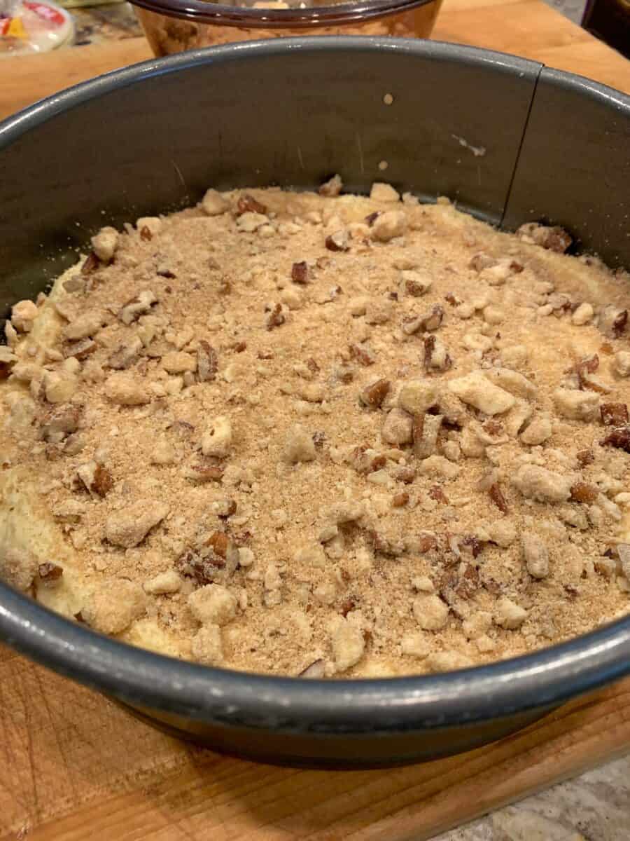 Pecans on top of the cake batter in a pan. 