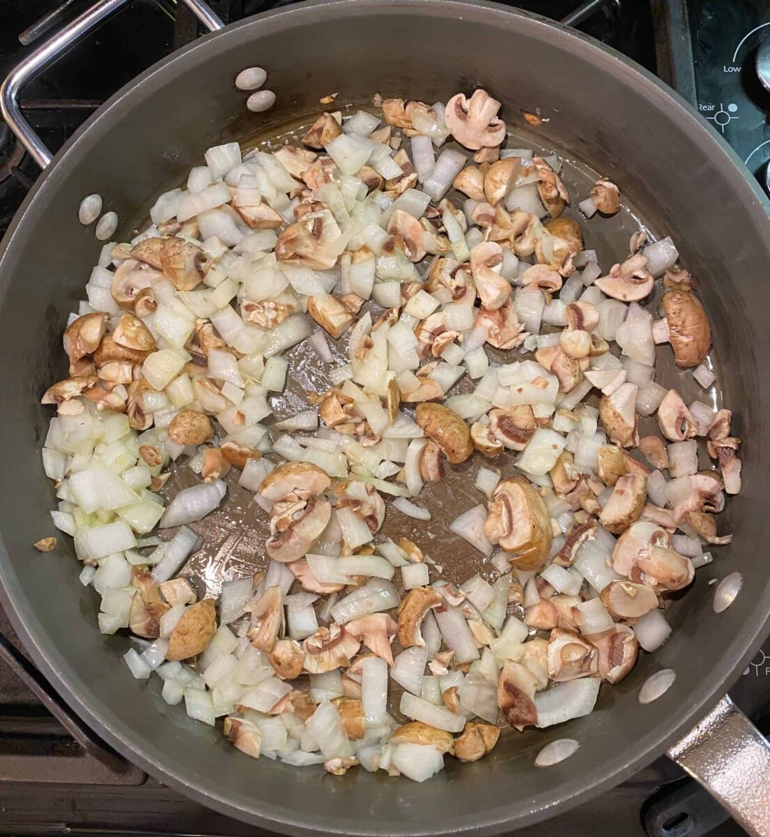 Diced onions and mushroom in a large skillet.