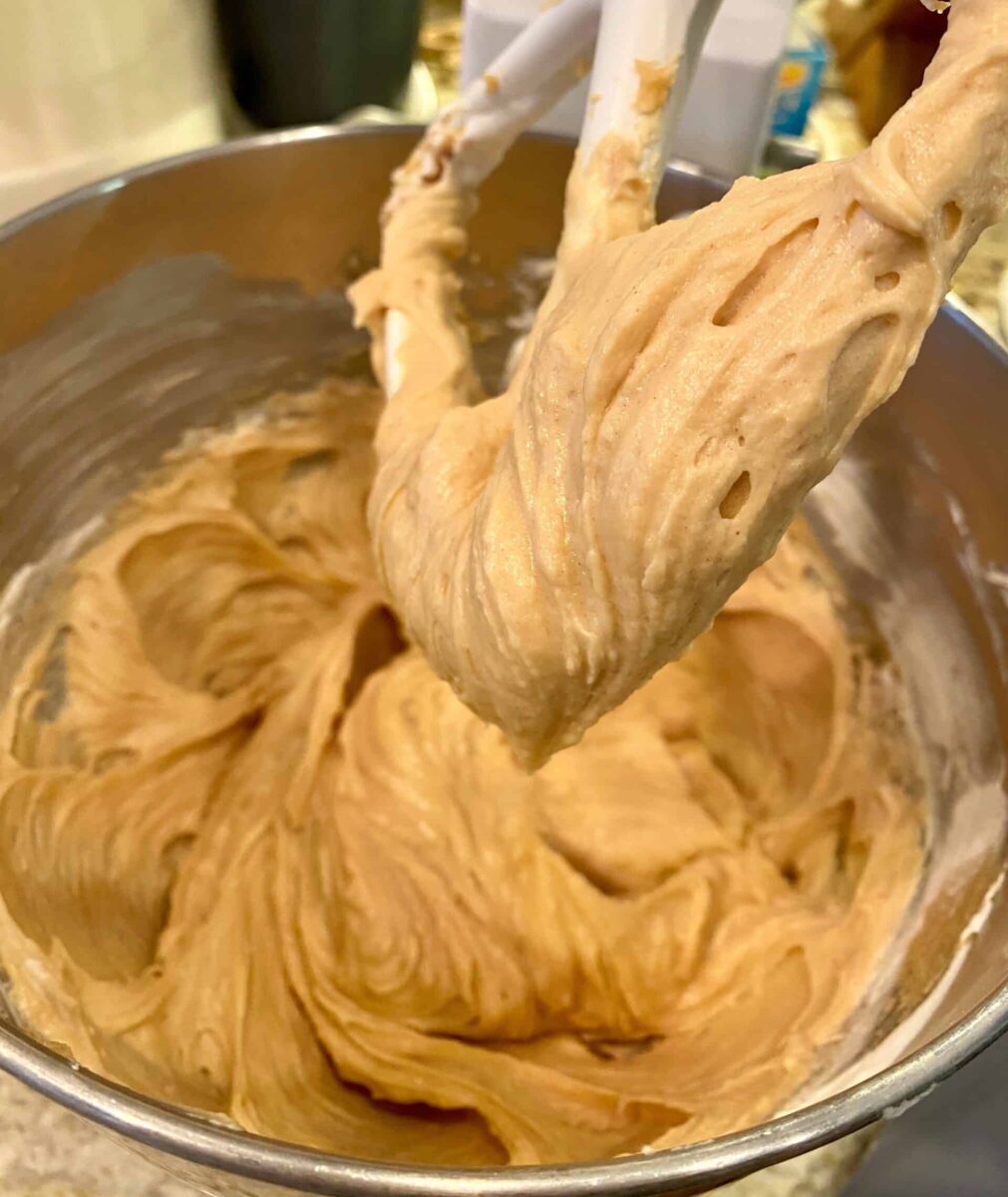 Cream cheese and peanut butter blended in a mixing bowl