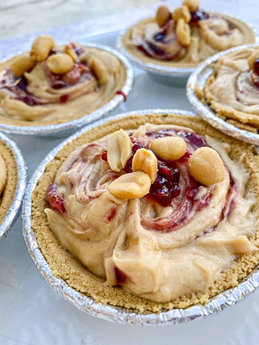 Small peanut butter pies assembled on a counter.