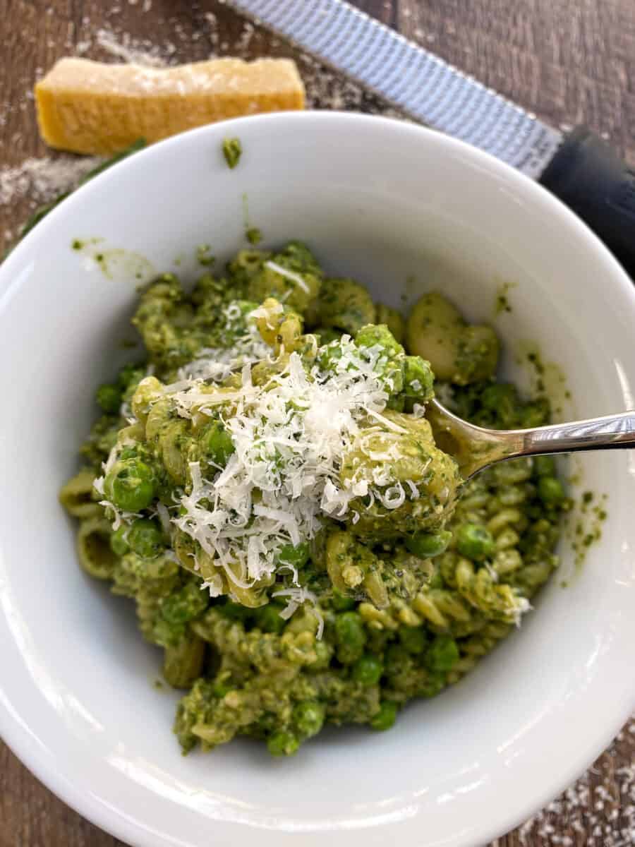 A bowl full of pesto pasta salad