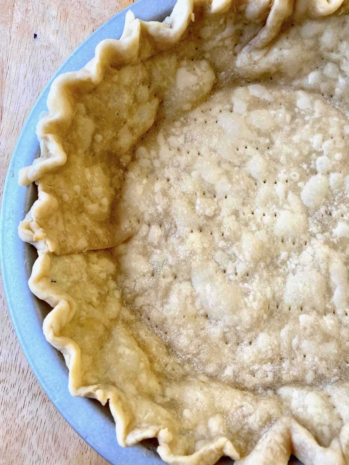 Baked pie crust in a pie dish.