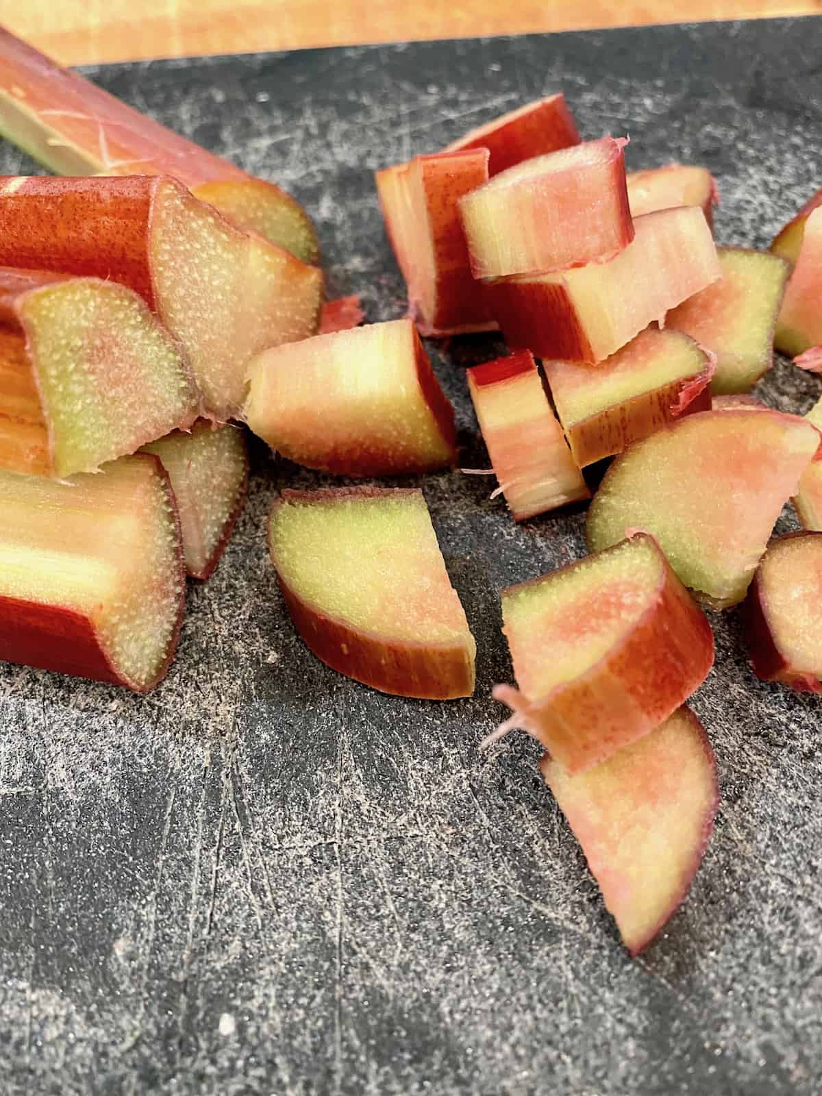 Diced rhubarb on a cutting board.