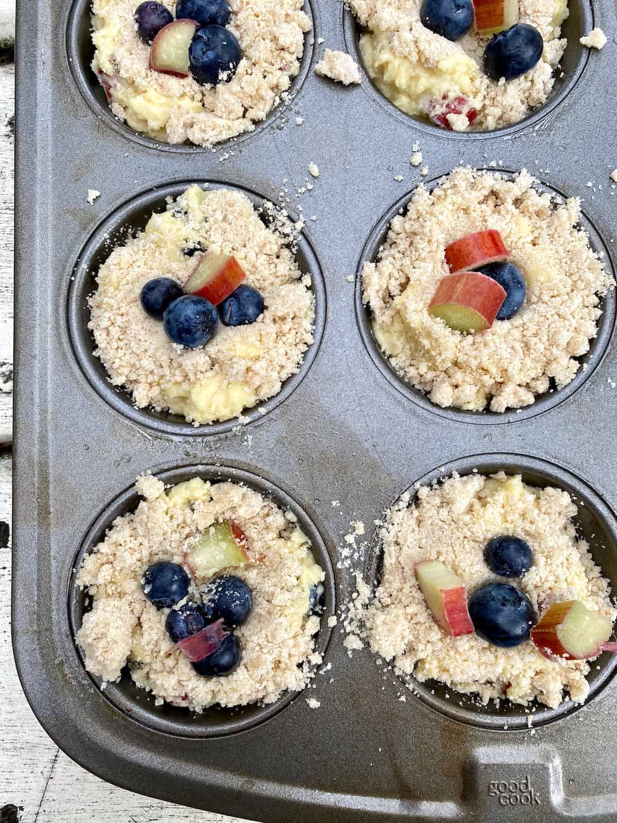 Unbaked muffins in a muffin pan. 