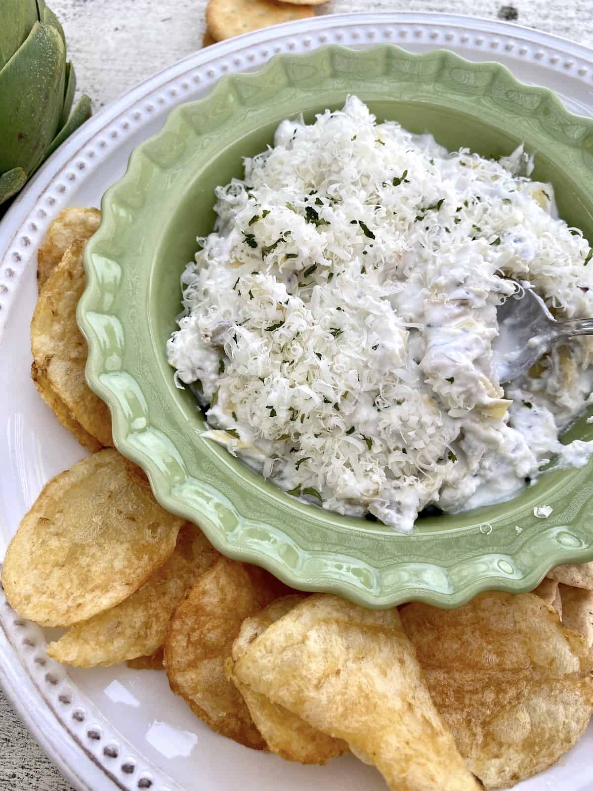 Dip in a small bowl with chips and crackers on the side. 