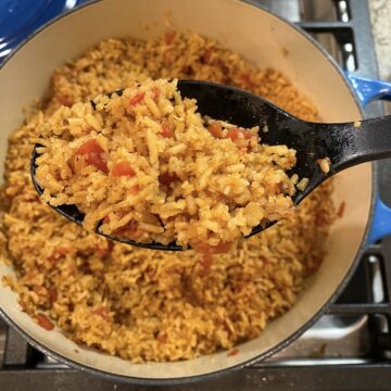 A large pot full of cooked Mexican rice.