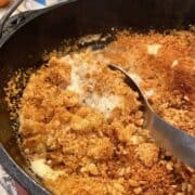 A large dutch oven full of chicken casserole with a crunchy top.