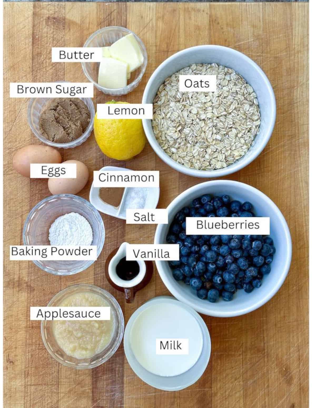 Ingredients for blueberry baked oatmeal, arranged on a cutting board.