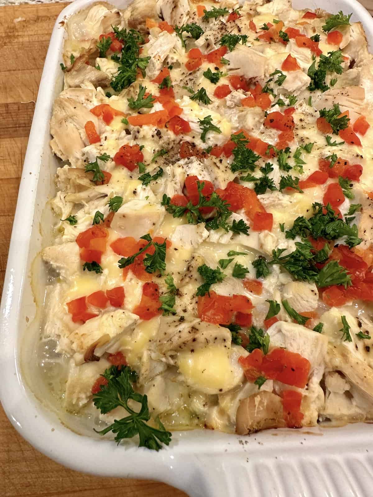 Baked chicken and stuffing casserole in a dish.