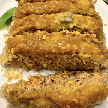 Sliced meatloaf on a platter.