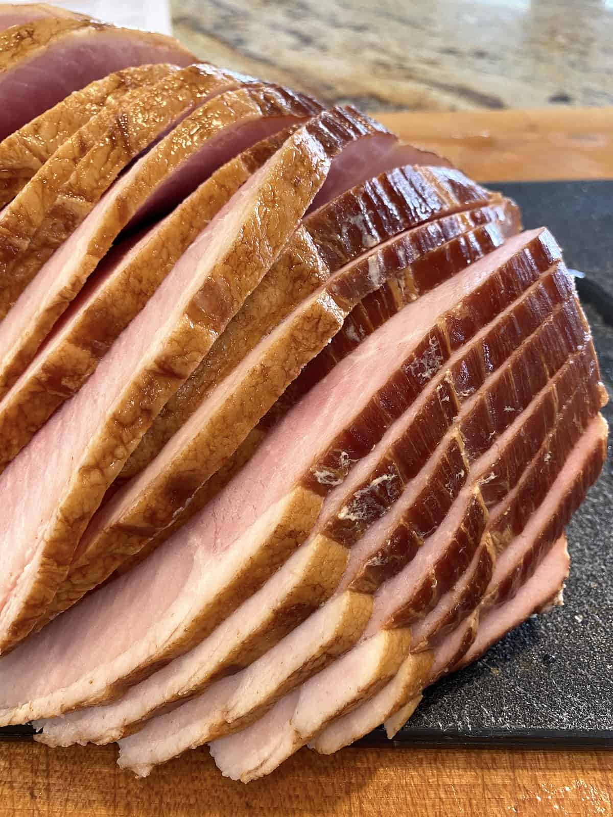 Sliced ham on a cutting board, .