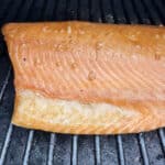 A piece of smoked salmon on the grill.