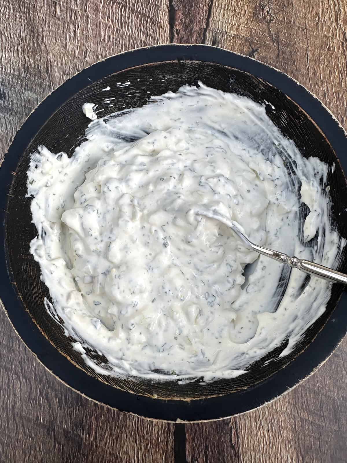 Tartar sauce ingredients blended in a bowl.