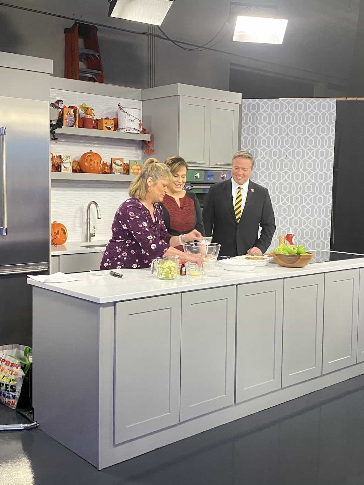 Melinda preparing food in a TV studio.