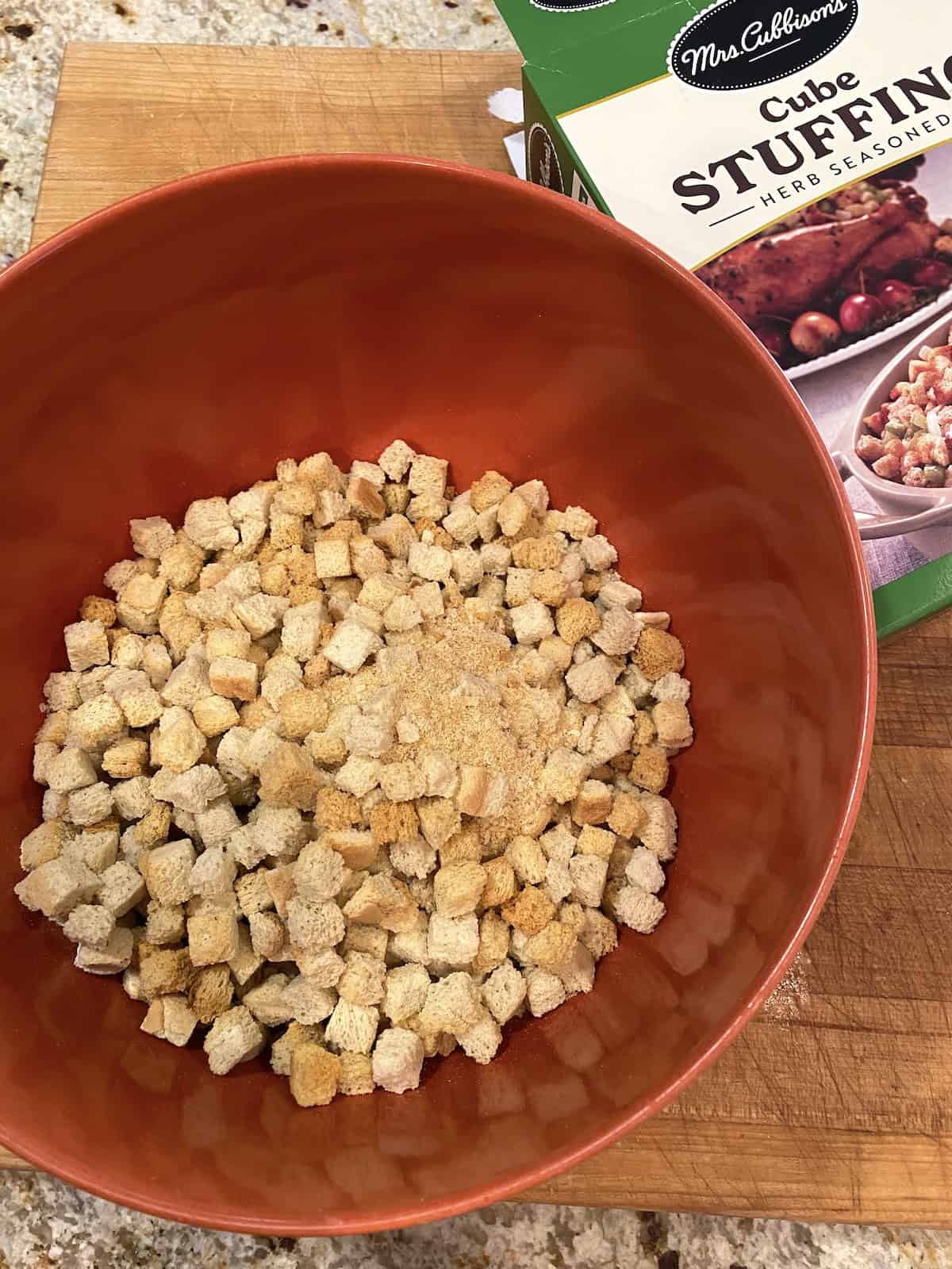 A bowl of cubed stuffing mix.