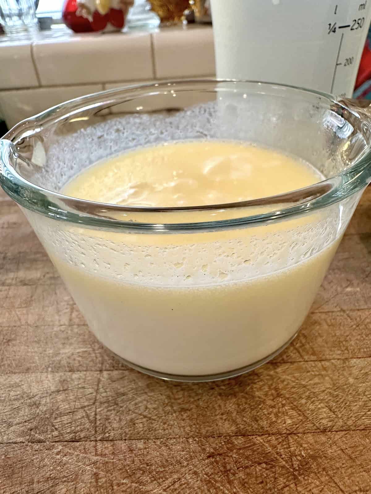 Melted butter with water and milk in a measuring cup.