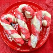 Candy cane cookies on a plate.