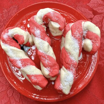 Candy cane cookies on a plate.