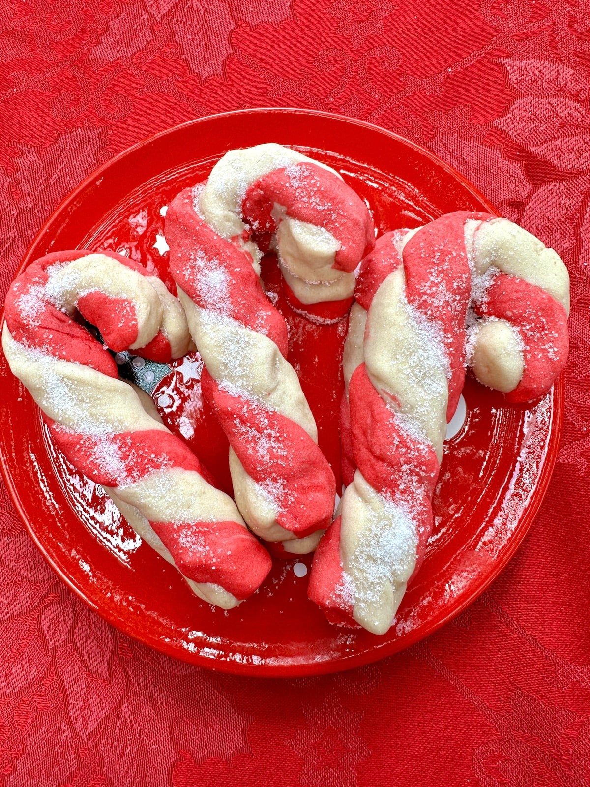 Candy cane cookies on a plate.