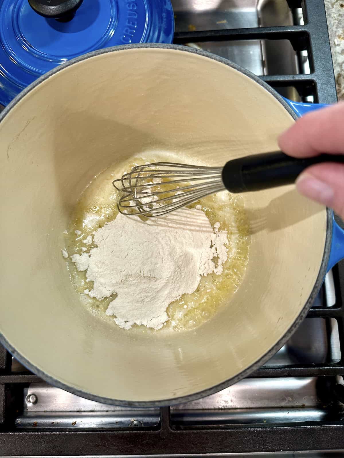 Butter and flour in a pan on the stove.