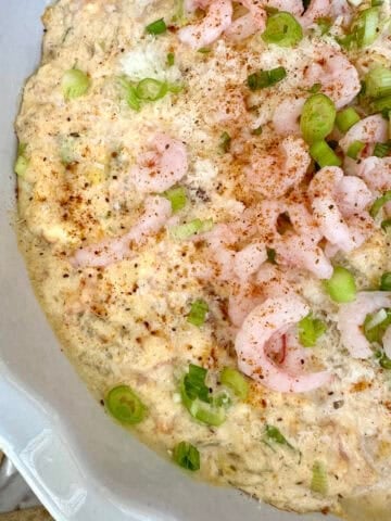 A baking dish with creamy shrimp and crab dip.