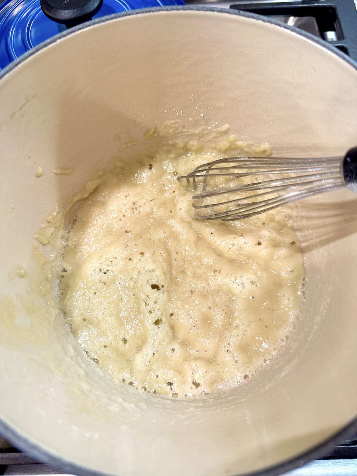 Butter and flour blended in a pan on the stove.