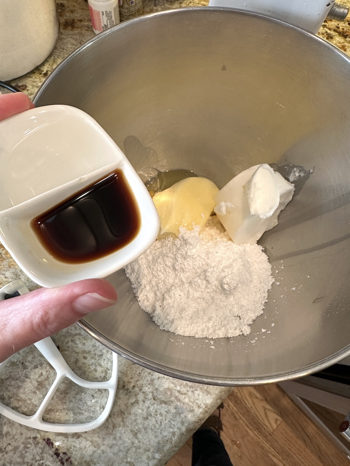 Cookie ingredients are unblended in a mixing bowl.