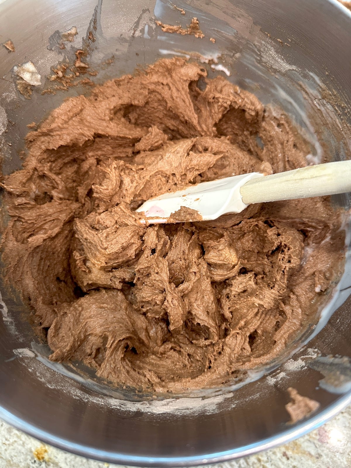 Chocolate zucchini cake batter in a mixing bowl.